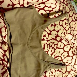 It is a medium tank top a nude color